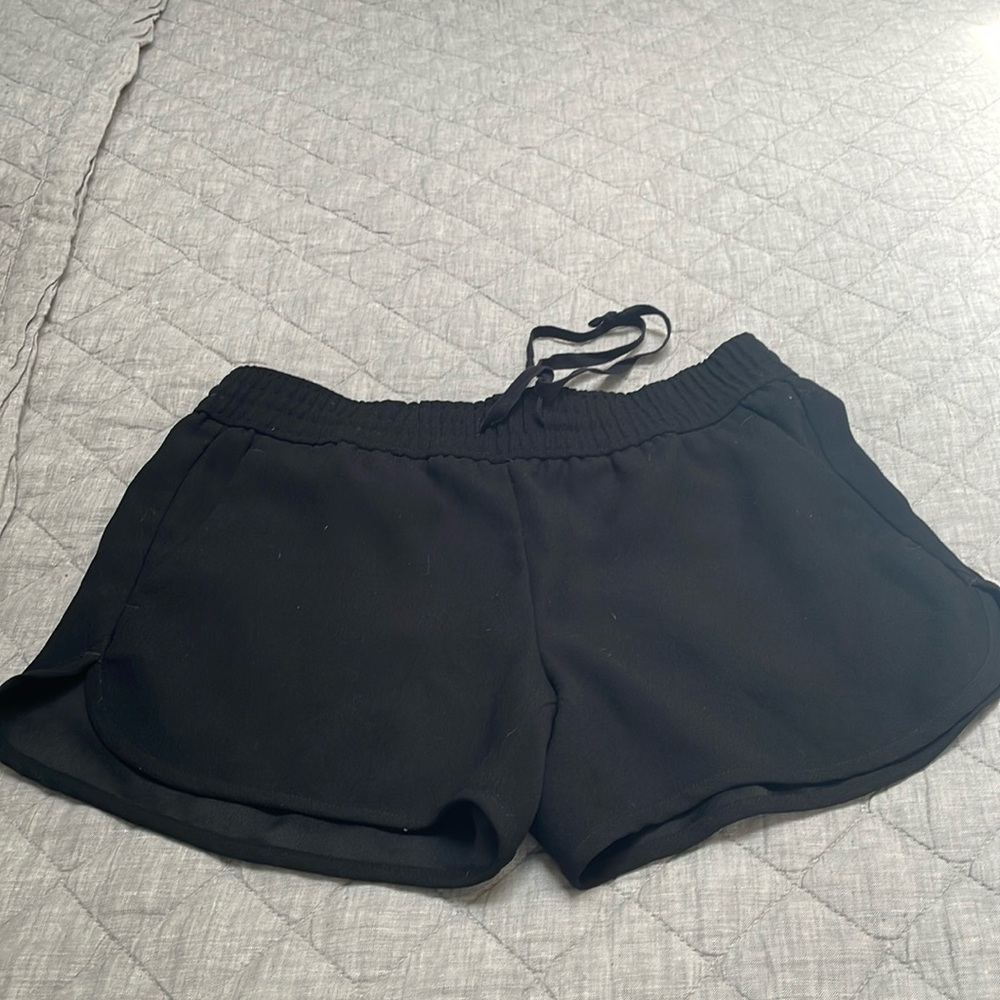 Cut black polyester black shorts.